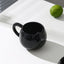 Adorable hand - painted cat - shaped ceramic mug, perfect for coffee or tea. - Korvel