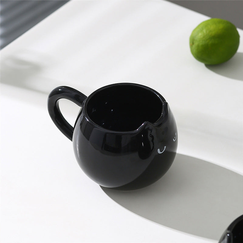 Adorable hand - painted cat - shaped ceramic mug, perfect for coffee or tea. - Korvel