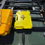 Billet aluminum Rotopax mount adapter for extrusion roof rack cross bars. - Korvel