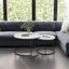 A set of nested 27.6-inch circular coffee tables with a wooden marble patterned tabletop and a sturdy metal frame (white) - Korvel