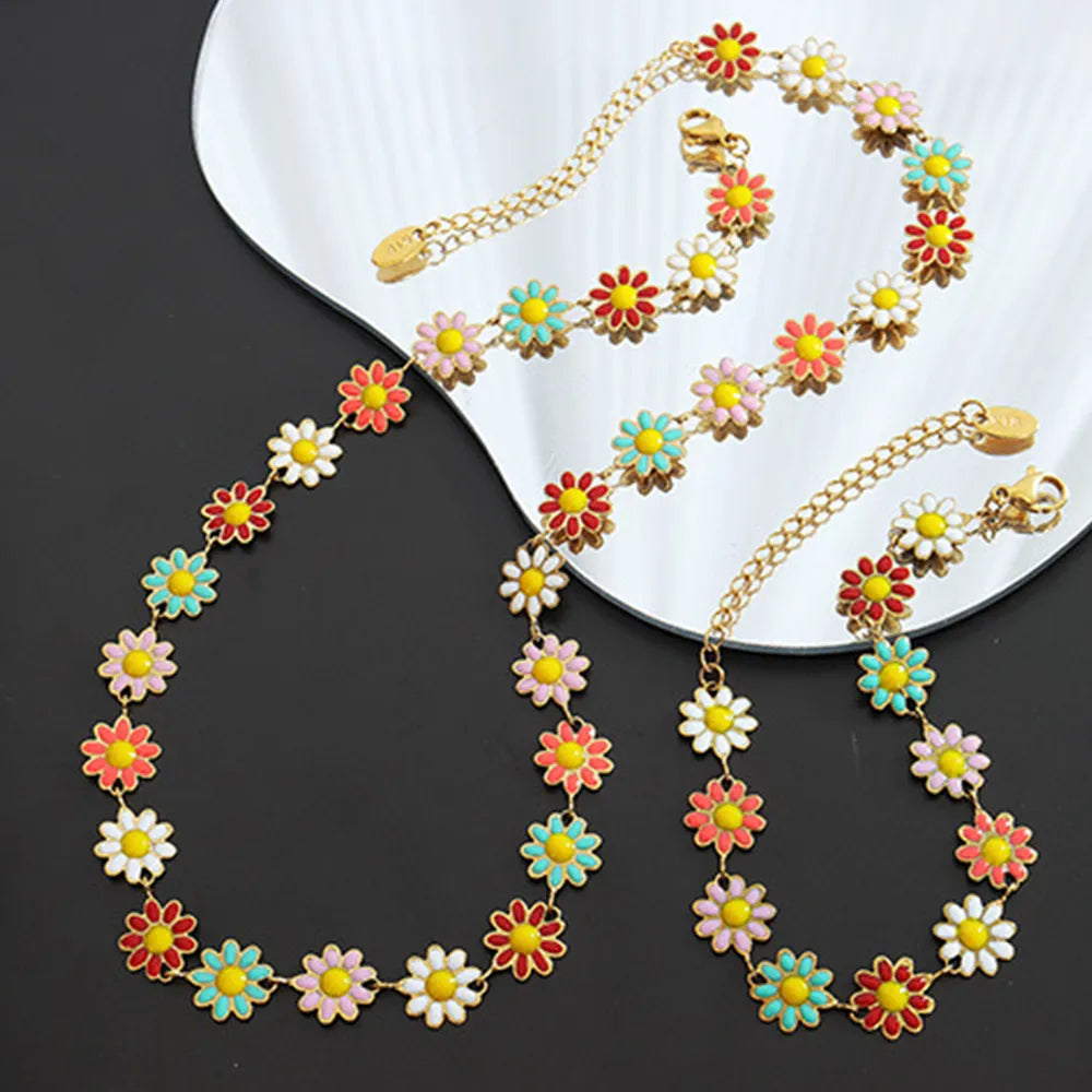 Collier en fleur avec goutte d'huile en acier titane