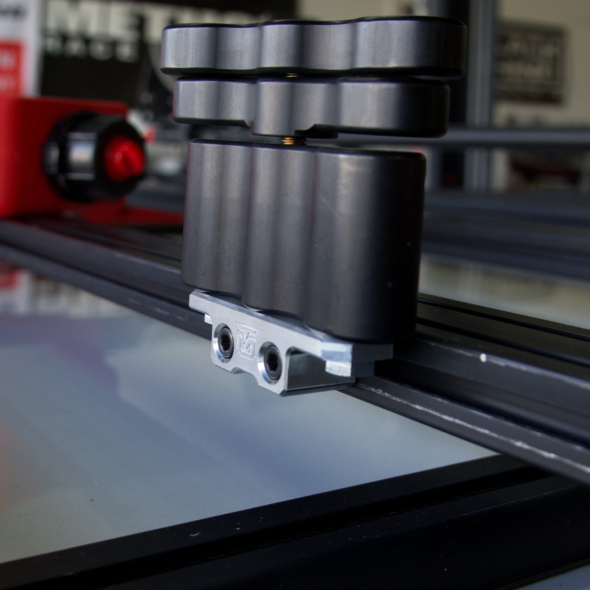 Billet aluminum Rotopax mount adapter for extrusion roof rack cross bars. - Korvel