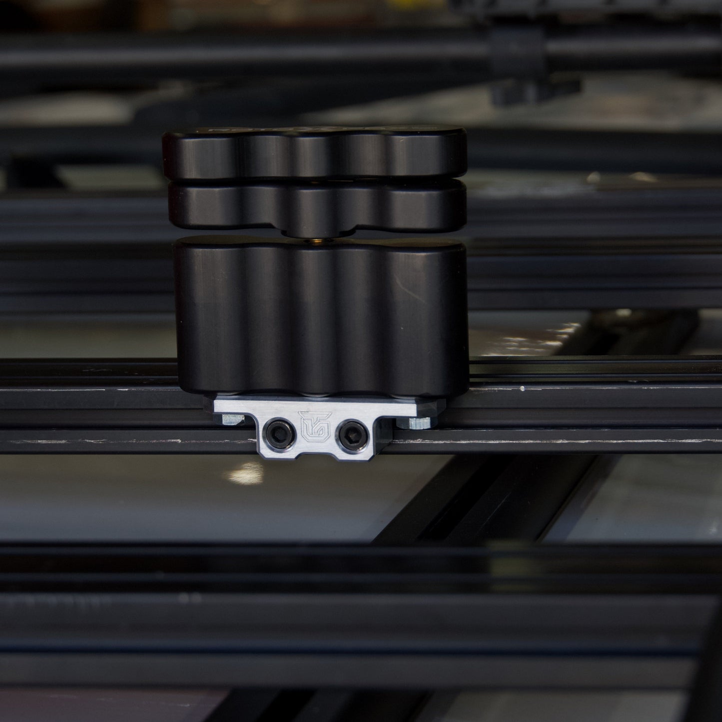 Billet aluminum Rotopax mount adapter for extrusion roof rack cross bars. - Korvel
