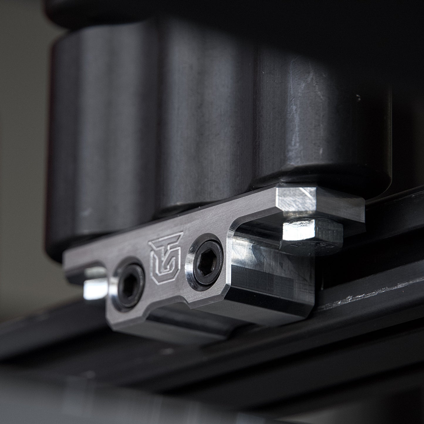 Billet aluminum Rotopax mount adapter for extrusion roof rack cross bars. - Korvel