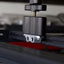 Billet aluminum Rotopax mount adapter for extrusion roof rack cross bars. - Korvel