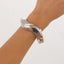 Bracelet Printanier à Bords Irréguliers avec Pliages Métalliques