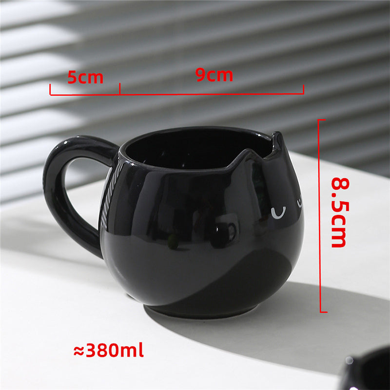 Adorable hand - painted cat - shaped ceramic mug, perfect for coffee or tea. - Korvel