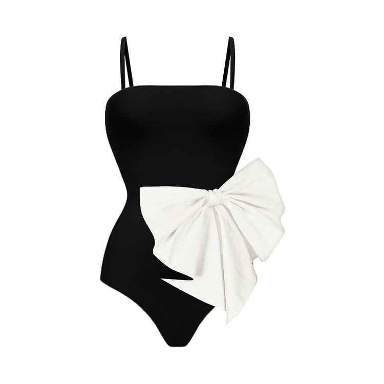 Elegante traje de baño de una pieza en blanco y negro con detalle de lazo