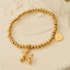 Pulsera con encanto de cachorro de acero de titanio chapado en oro de 18 quilates