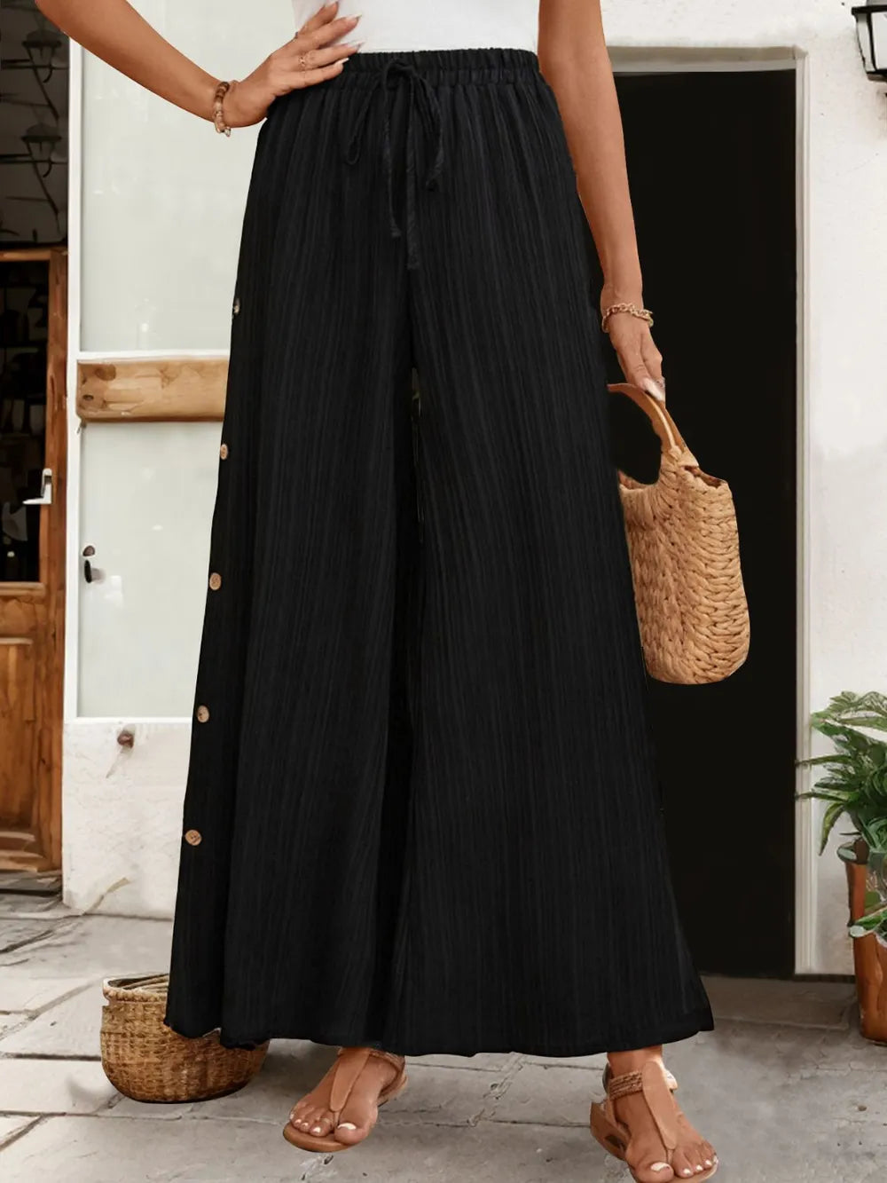 Pantalons larges à fente avec lien