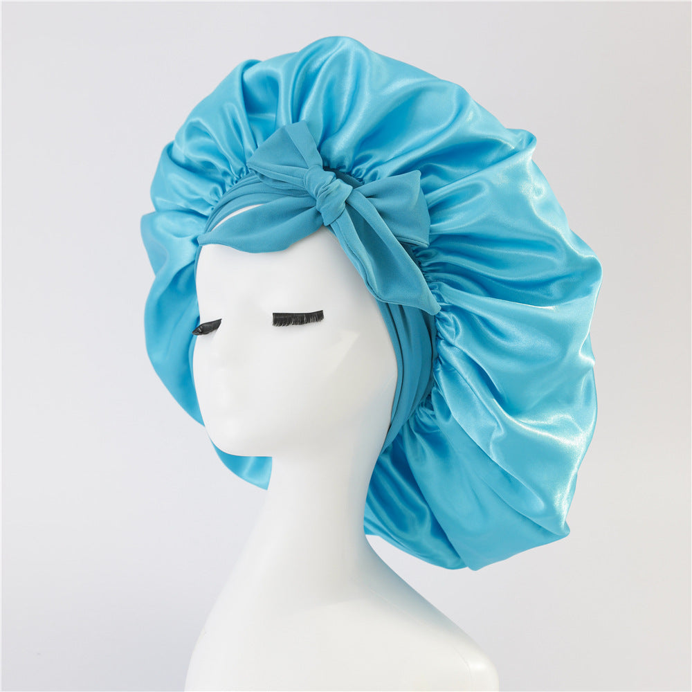 Turban élégant à large bord avec détail en nœud