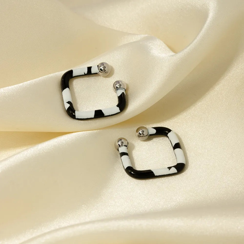 Boucles d'oreilles en acier inoxydable avec goutte d'huile