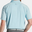 Polo de golf liso con mezcla de texturas FootJoy