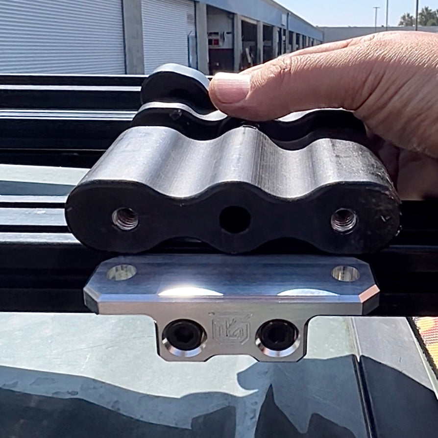 Billet aluminum Rotopax mount adapter for extrusion roof rack cross bars. - Korvel