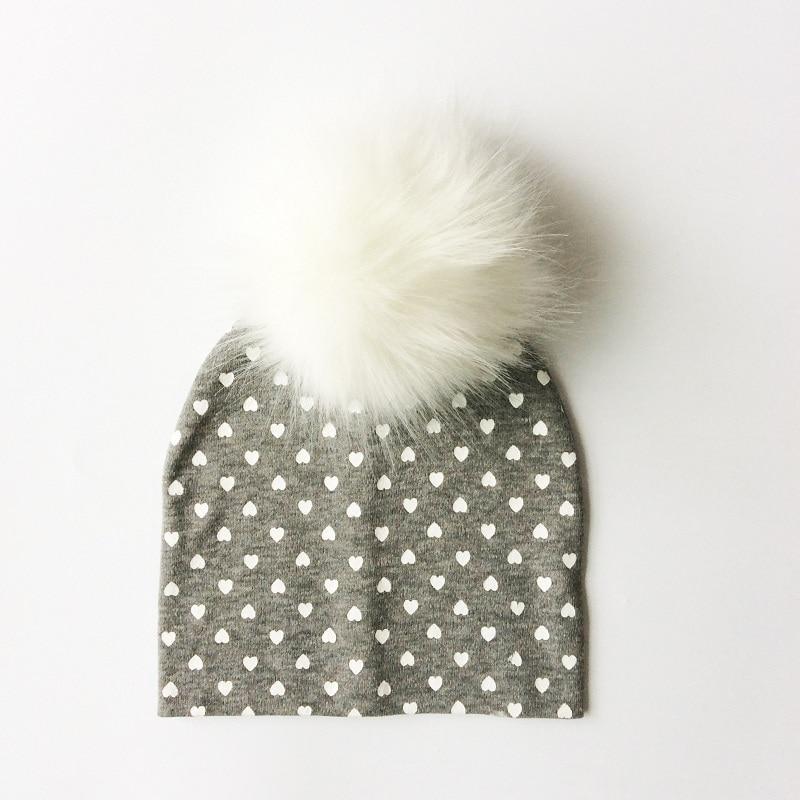 Chapeau de bébé moderne de luxe avec pompon pour l'automne et l'hiver