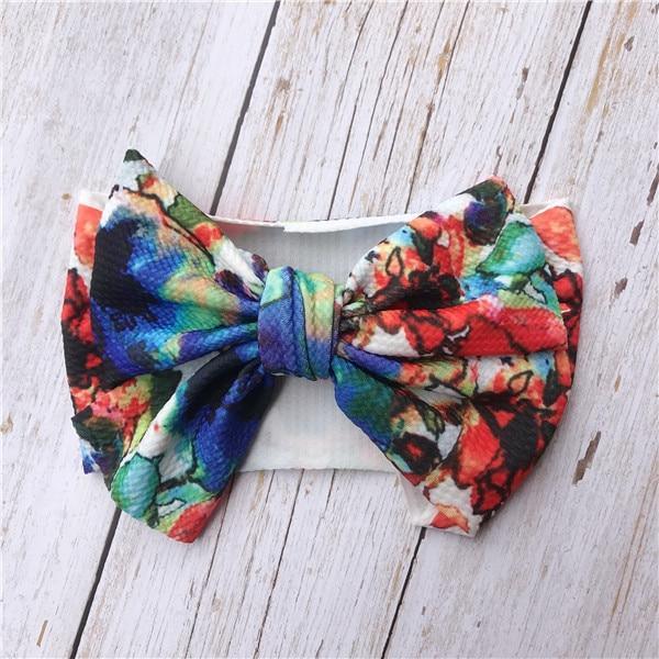 Diadema de lujo colorida para recién nacidos y niños pequeños con lazo