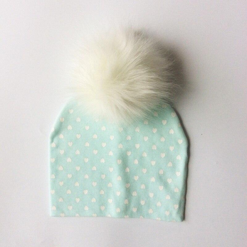 Chapeau de bébé moderne de luxe avec pompon pour l'automne et l'hiver