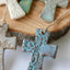 Lace-Embellished Flared Cross Ornament - Korvel