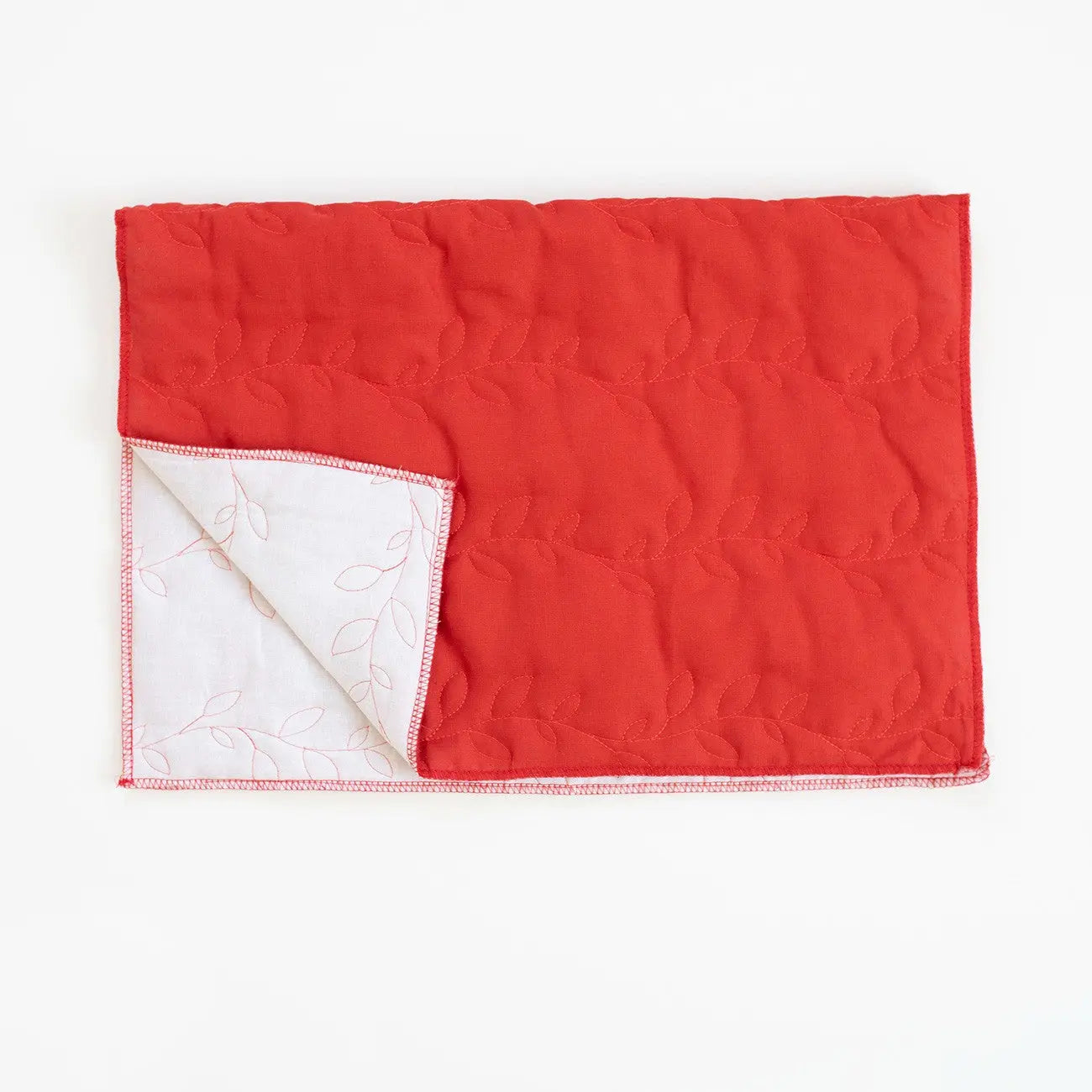Housse de coussin en lin rouille matelassée
