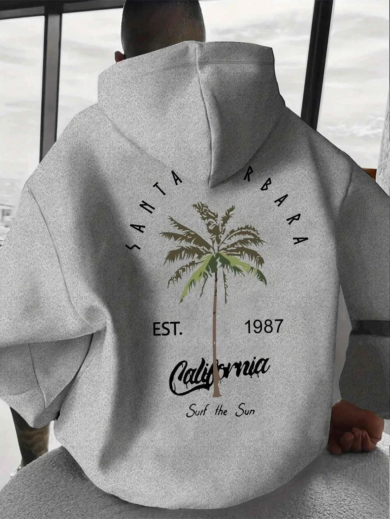 Sudadera con capucha estampada de palmeras tropicales
