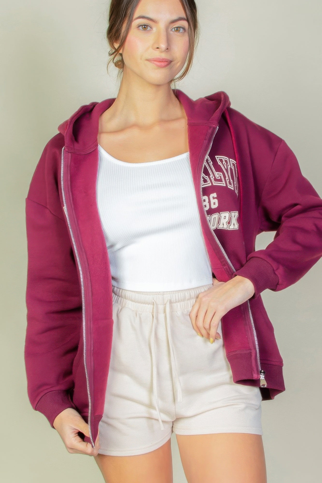 Sudadera con cremallera y hombros caídos gráficos
