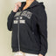 Sudadera con cremallera y hombros caídos gráficos