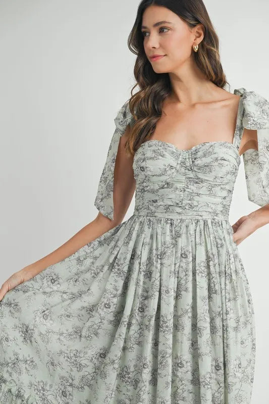 Robe midi froncée à buste floral avec lien d'épaule