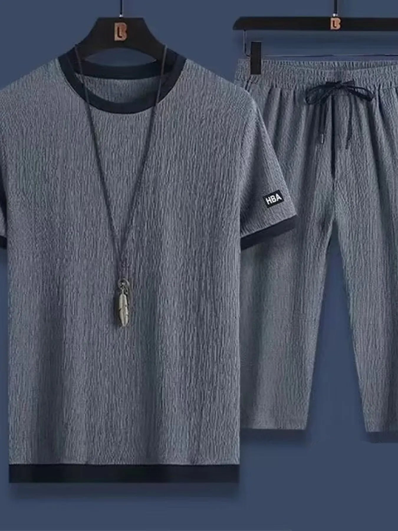 Conjunto de camiseta de cuello redondo de manga corta y pantalones cortos para hombres en tallas gra