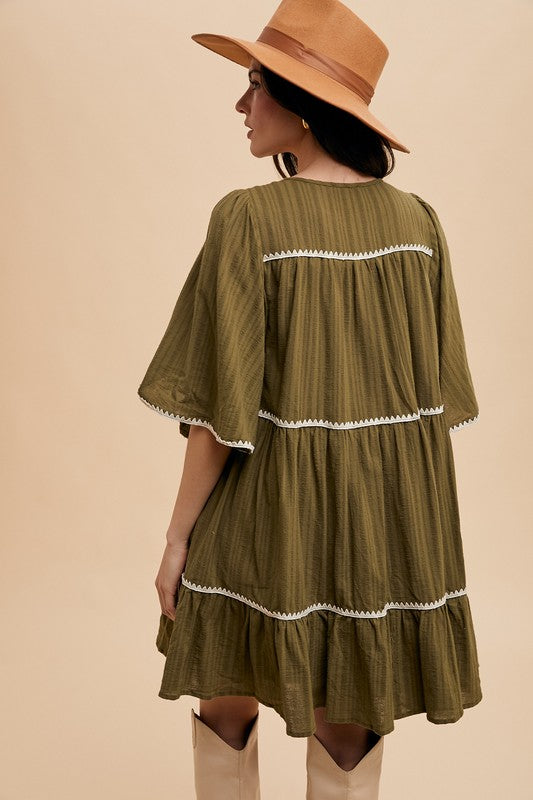 Chic Bohemian Tiered Dress with Tassel Details and Contrast Trim - Korvel