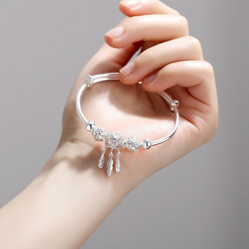 Bracelet en argent sterling réglable avec charme attrape-rêves et plume