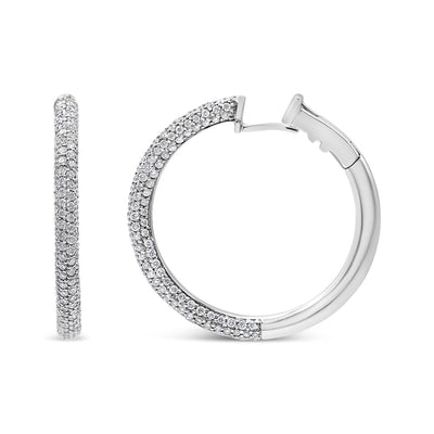 Pendientes de aro semi eternidad de diamantes engastados en pavé de oro blanco de 18 quilates