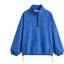 Chaqueta con capucha de media cremallera y lunares a la moda
