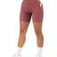 Shorts de sport croisés pour femmes avec ceinture et poches