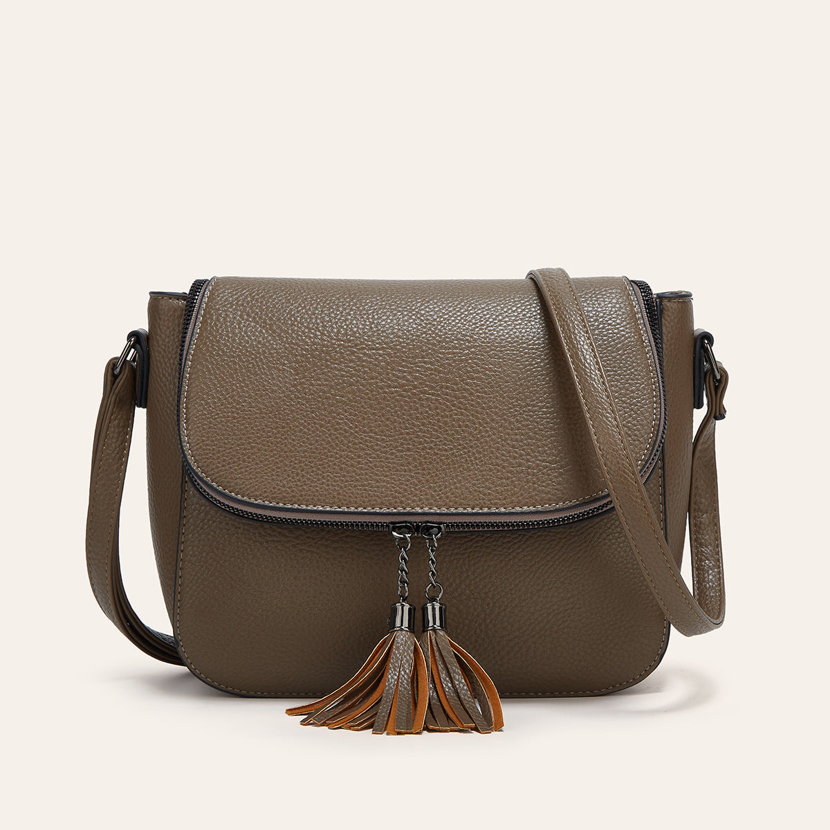 Fashionable Flip-Top Saddle Bag with Tassels