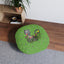 Coussin rond Curious Garden Cat – Coussin d'accent à imprimé pattes vertes