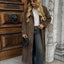 Manteau long élégant avec ceinture et design double boutonnage