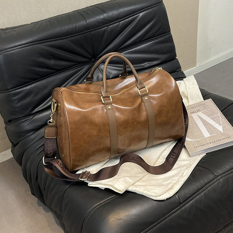 Elegante bolsa de viaje de duffel con textura de PU en colores sólidos