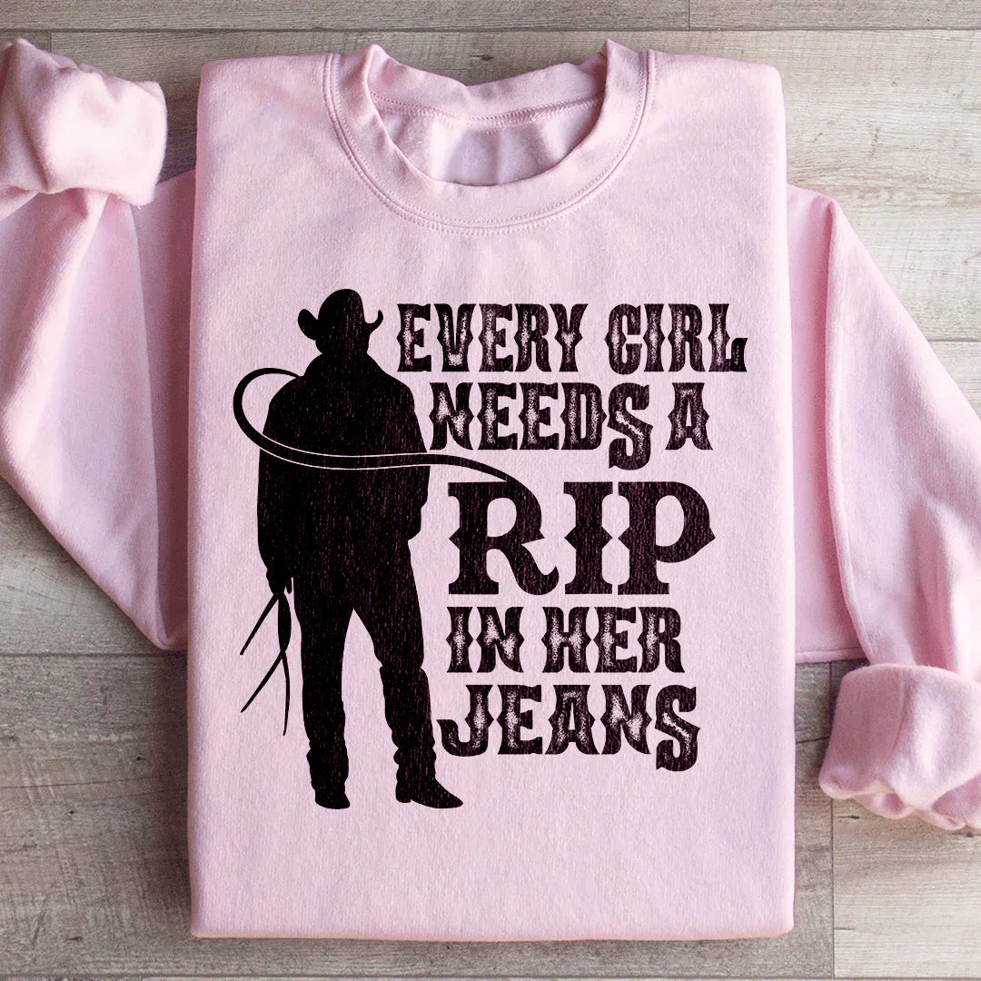 Chaque fille a besoin d'un déchiré dans son sweat-shirt en jeans
