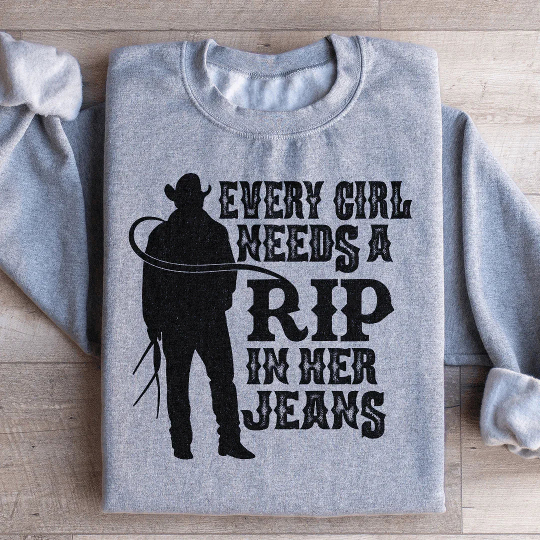 Chaque fille a besoin d'un déchiré dans son sweat-shirt en jeans