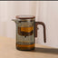 Elegante tetera de vidrio y juego de té con separación de agua