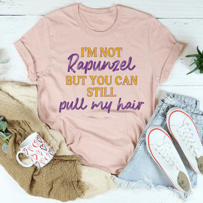 No soy Rapunzel pero aún puedes tirarme del pelo
