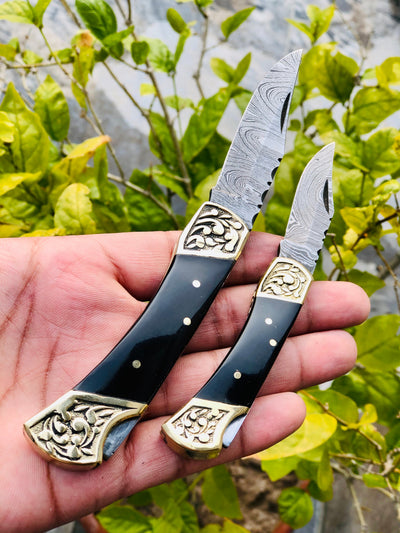 Exquisite Pair of Custom Handmade Damascus Steel Folding Pocket Knives with Buffalo Horn Handles and Engraved Brass Bolsters - Korvel