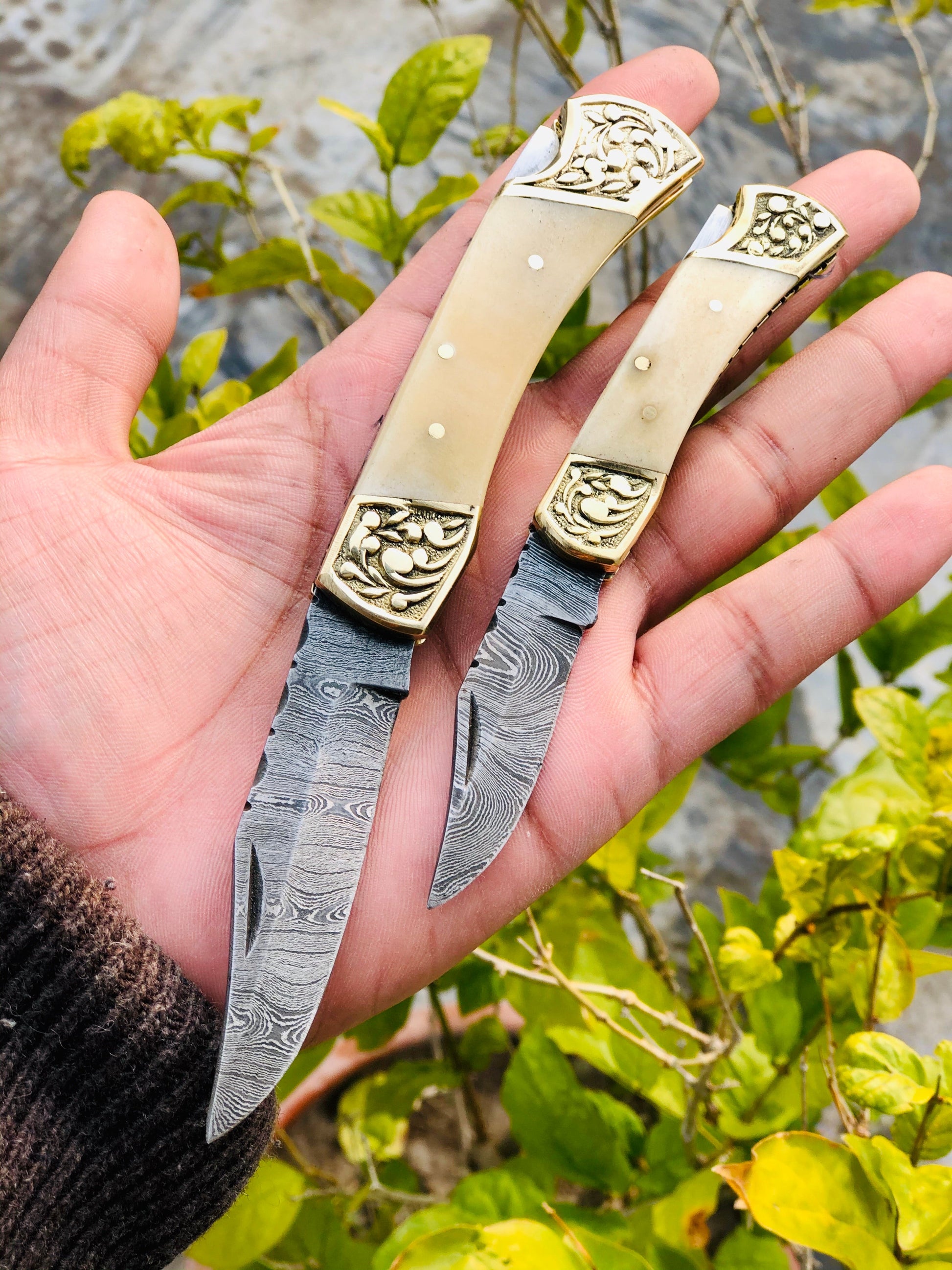 Exquisite Pair of Custom Handmade Damascus Steel Folding Pocket Knives with Bone Handles and Engraved Brass Bolsters - Korvel