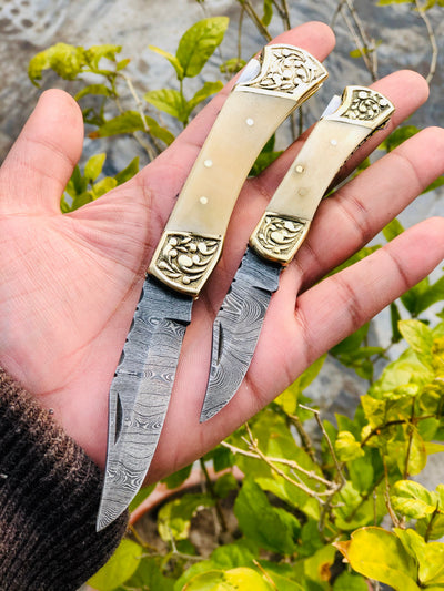 Exquisite Pair of Custom Handmade Damascus Steel Folding Pocket Knives with Bone Handles and Engraved Brass Bolsters - Korvel