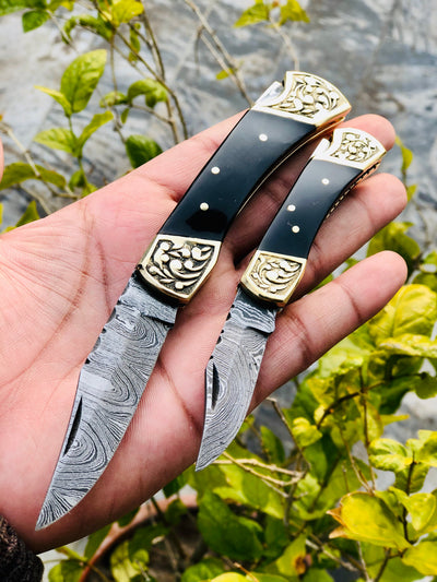 Exquisite Pair of Custom Handmade Damascus Steel Folding Pocket Knives with Buffalo Horn Handles and Engraved Brass Bolsters - Korvel