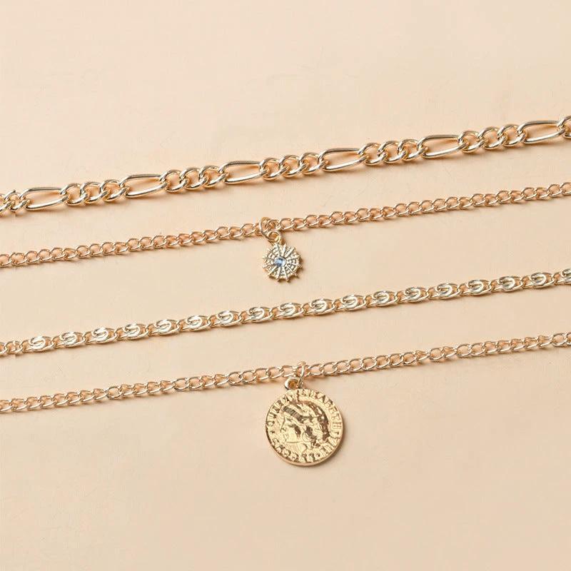 Mandotos Chunky Gold Layered Necklace with Coin Pendant and Sun Charm