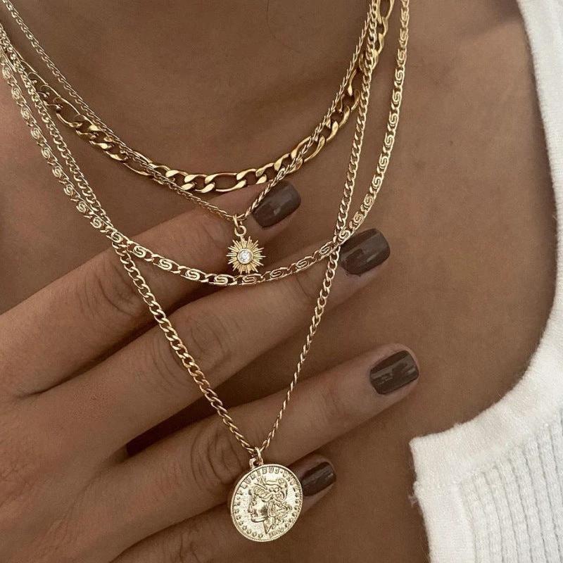 Mandotos Chunky Gold Layered Necklace with Coin Pendant and Sun Charm