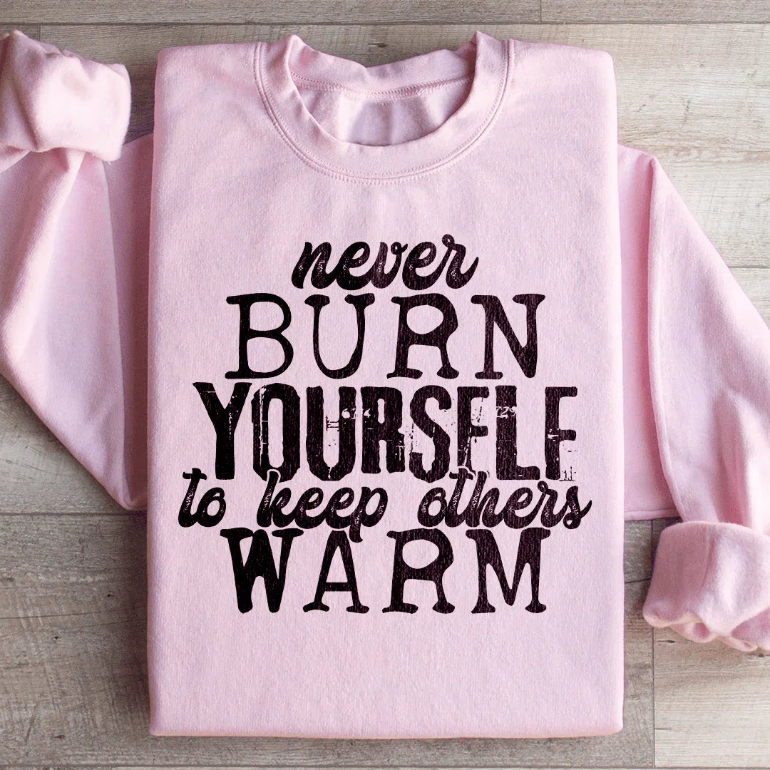 Sudadera "Nunca te quemes para mantener calientes a los demás"
