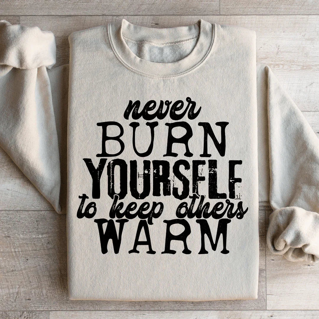 Sudadera "Nunca te quemes para mantener calientes a los demás"
