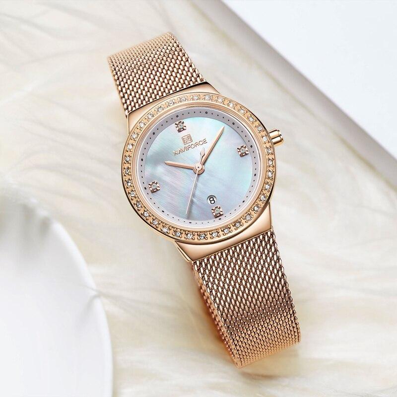 Montre analogique de luxe pour femmes avec affichage de la date et bracelet en acier inoxydable